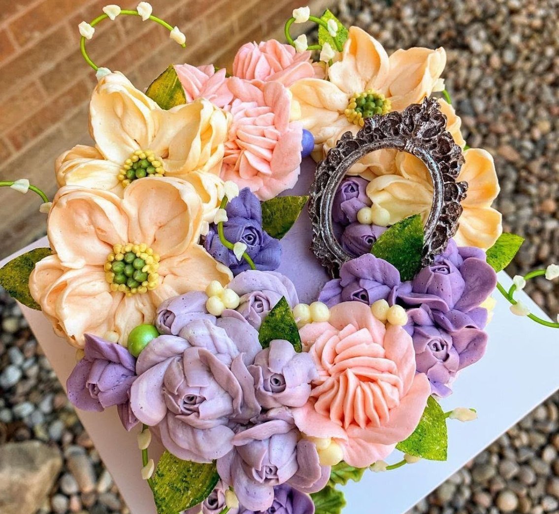 Peach and purple flower cake with an oval frame