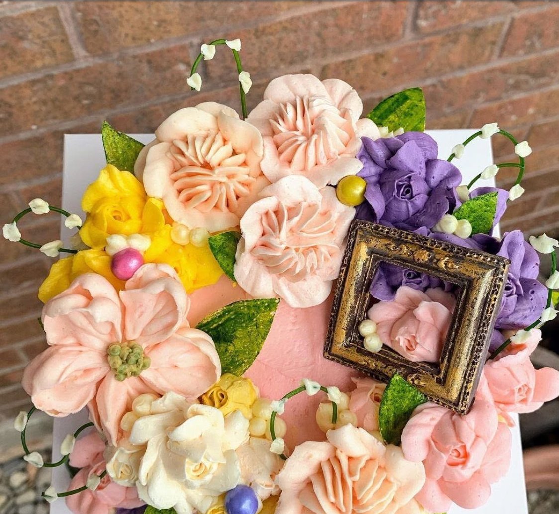 Pink buttercream flower cake seen from above